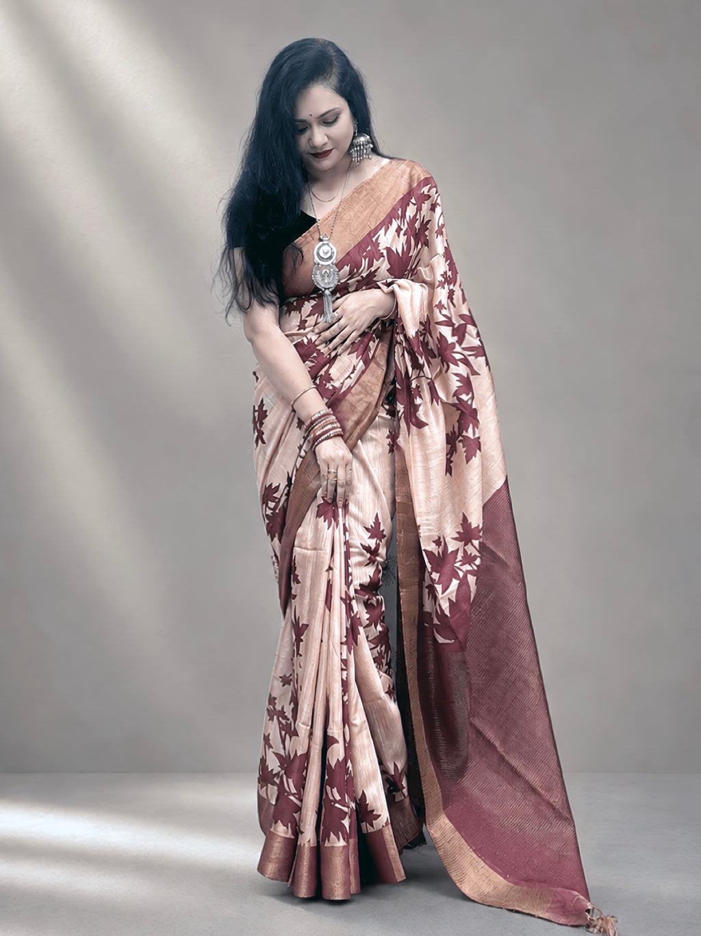 Kasturi Maroon Tussar Ghicha Silk Cotton Saree with Floral Motifs & Zari Border