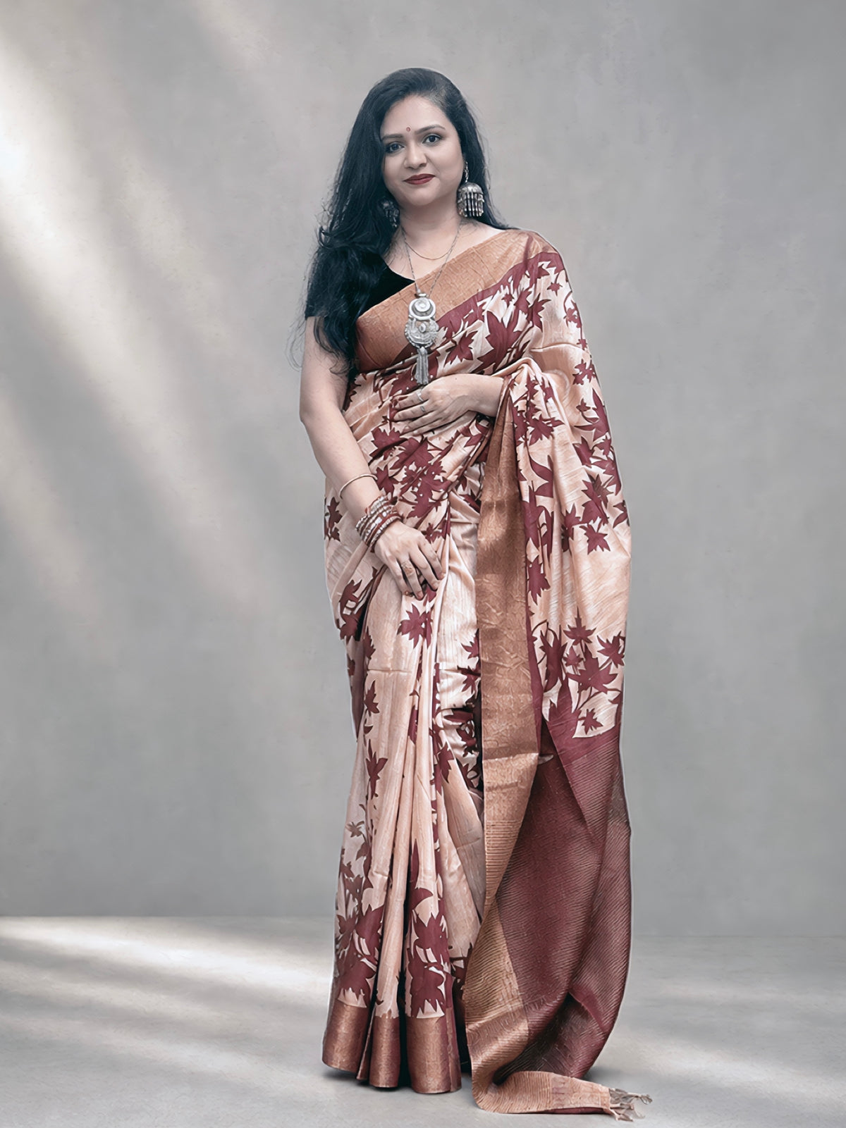 Kasturi Maroon Tussar Ghicha Silk Cotton Saree with Floral Motifs & Zari Border