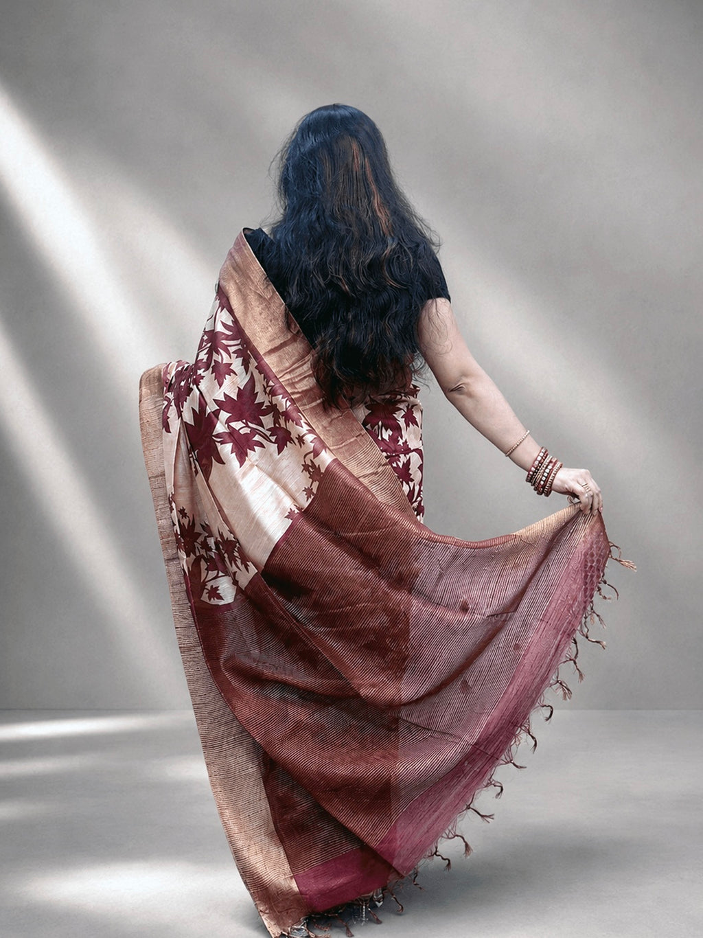 Kasturi Maroon Tussar Ghicha Silk Cotton Saree with Floral Motifs & Zari Border