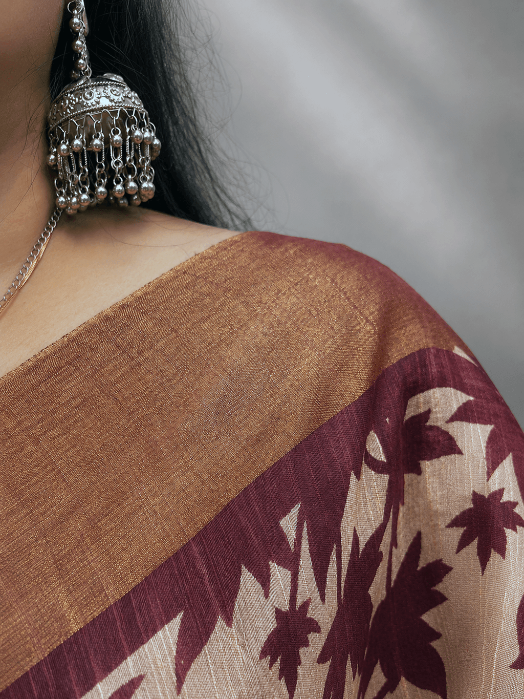 Kasturi Maroon Tussar Ghicha Silk Cotton Saree with Floral Motifs & Zari Border