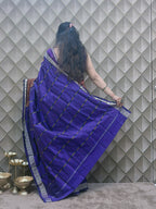 Kesarneel — Saffron & Blue With silver Floral Motif Sambalpuri Silk Saree