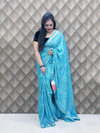 Light Blue Tribal Print Crepe Saree with White Floral & Geometric Patterns