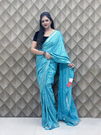 Light Blue Tribal Print Crepe Saree with White Floral & Geometric Patterns