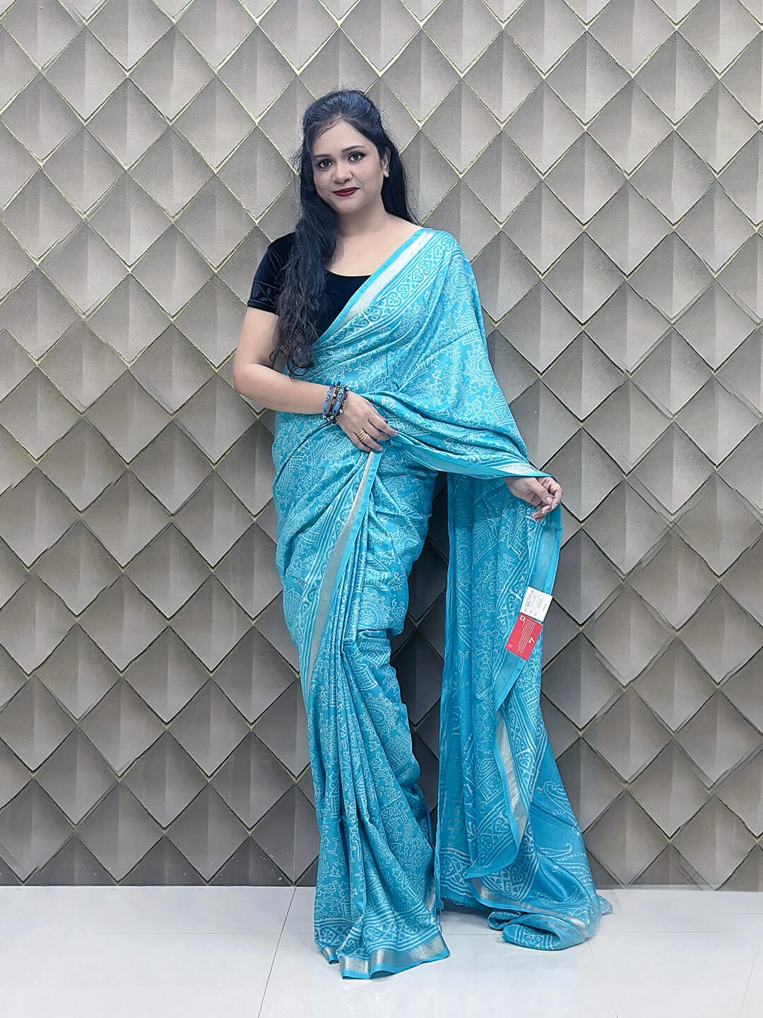 Light Blue Tribal Print Crepe Saree with White Floral & Geometric Patterns