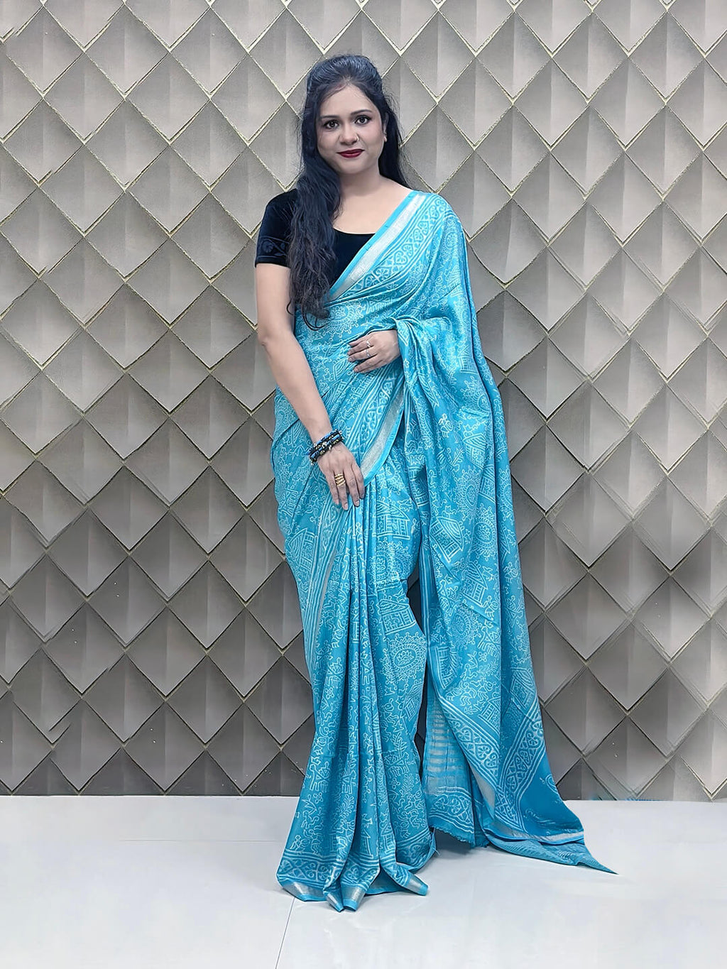 Light Blue Tribal Print Crepe Saree with White Floral & Geometric Patterns