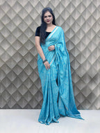 Light Blue Tribal Print Crepe Saree with White Floral & Geometric Patterns