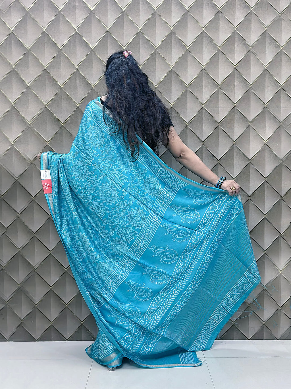 Light Blue Tribal Print Crepe Saree with White Floral & Geometric Patterns