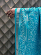 Light Blue Tribal Print Crepe Saree with White Floral & Geometric Patterns