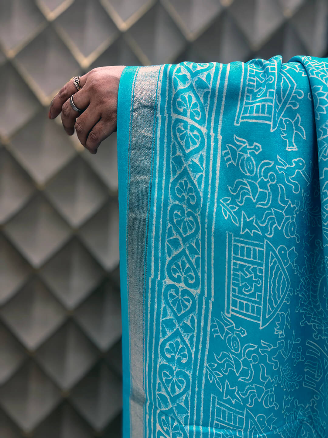 Light Blue Tribal Print Crepe Saree with White Floral & Geometric Patterns