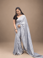 Silver Grey Crepe Silk Saree with Floral & Geometric Motifs and Zari Border