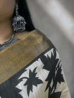 Kasturi Brown Tussar Ghicha Silk Cotton Saree with Brown Floral Motifs & Zari Border